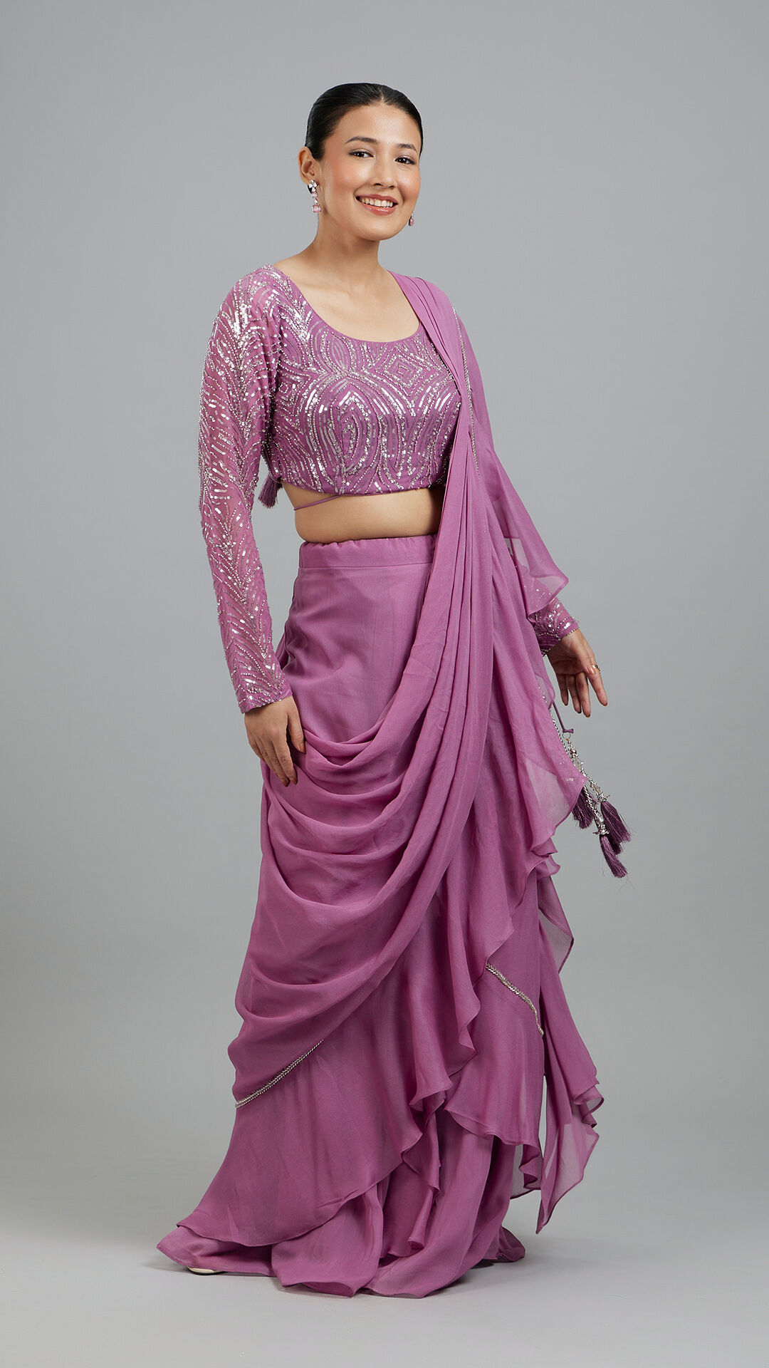 Women wearing stylish pink saree with matching full sleeves blouse for wedding 